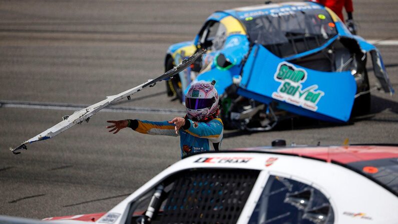 NASCAR Xfinity Series driver Joey Gase throws wrecked bumper at Dawson Cram during race