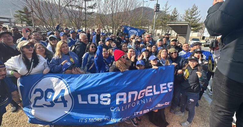 Dedicated Dodgers fans visit DMZ, hope they can score game tickets
